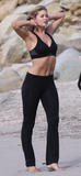 Doutzen Kroes in spandex and sports bra on beach for Victoria's Secret Catalog photo shot in St Barths - Hot Celebs Home